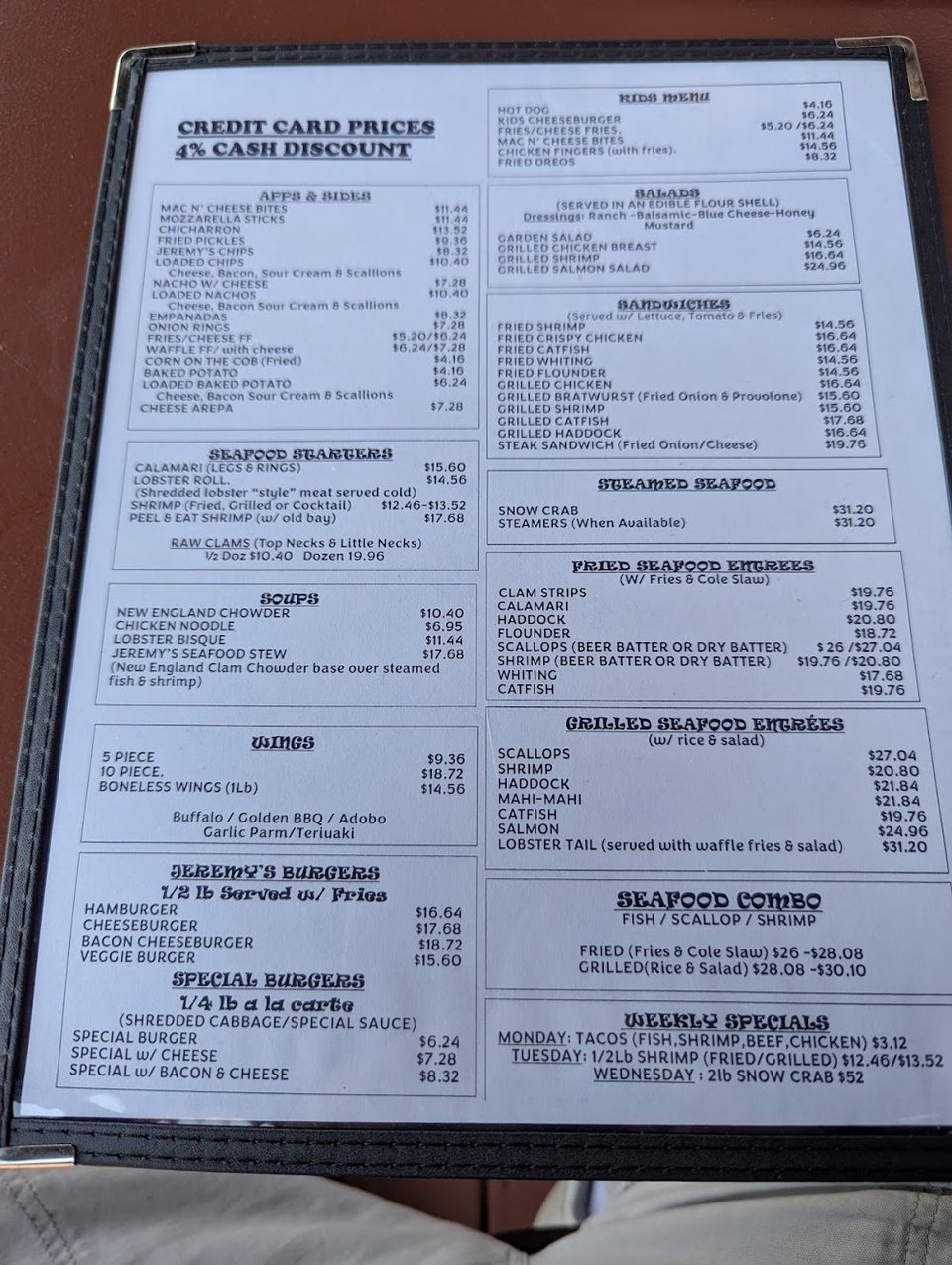 Bar menu featuring shrimp, salads, and nachos.